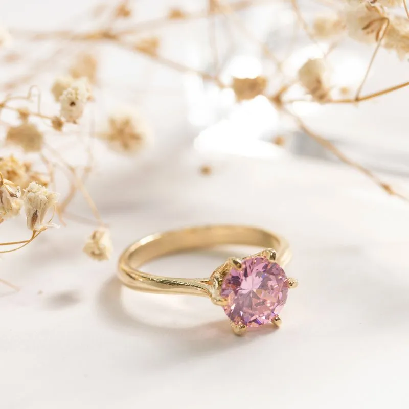 gold plated closed ring with pink cz 8mm facet