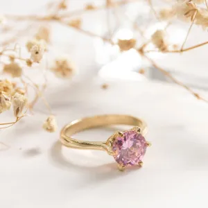 gold plated closed ring with pink cz 8mm facet
