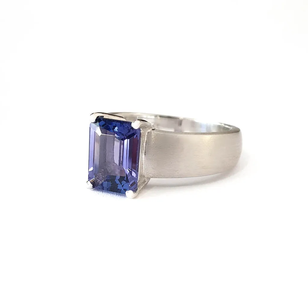 Handcrafted Unisex Emerald Cut Tanzanite Ring with Brushed Band Detail