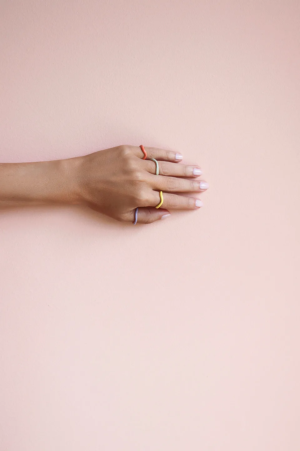 SET OF FOUR WAVE RINGS WITH MULTI COLORED ENAMEL