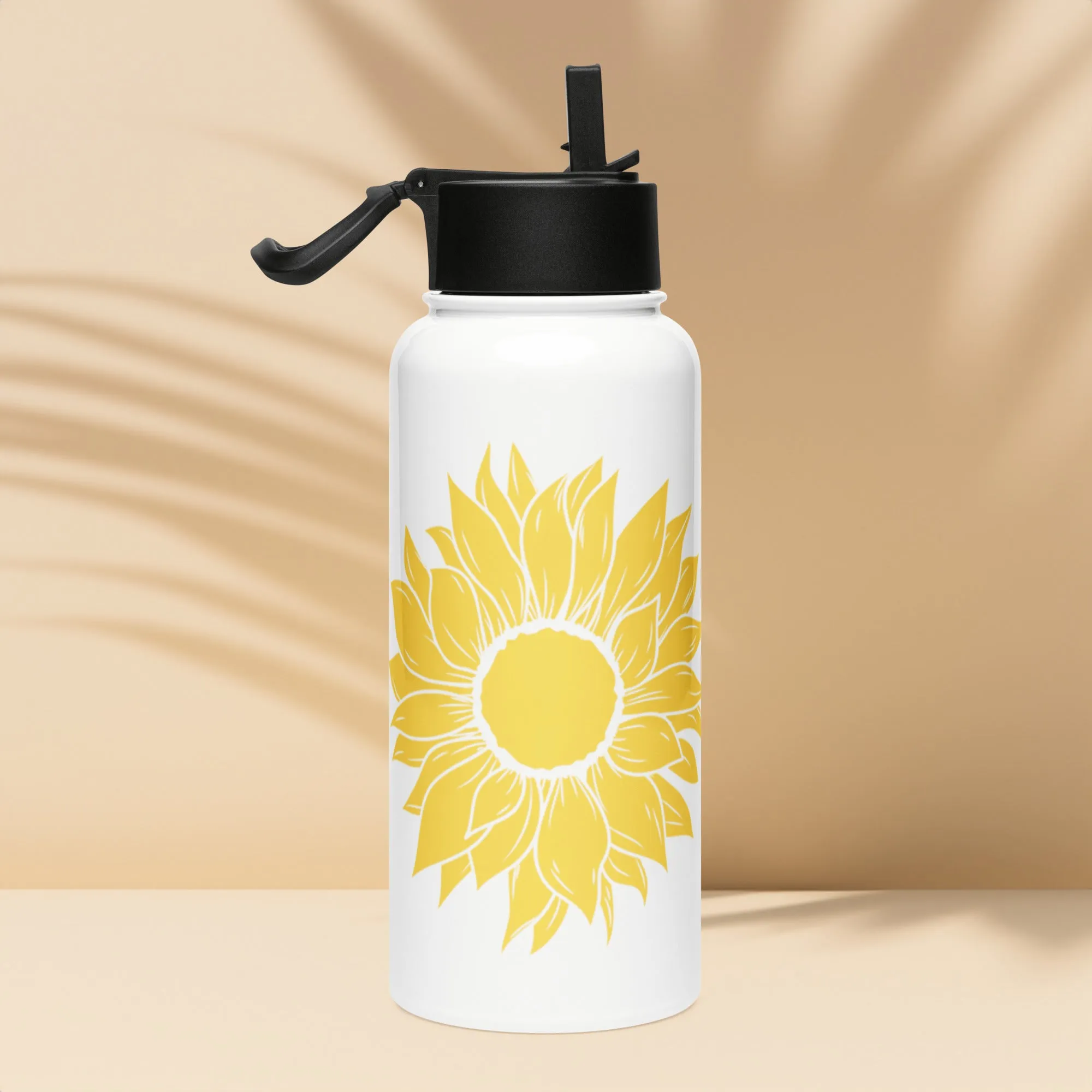 Stainless steel water bottle with a straw lid